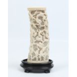 A nineteenth century Cantonese carved ivory tusk vase. With pierced ground, carved with dragons,
