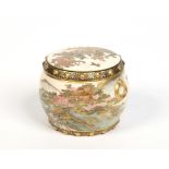 A Japanese Satsuma drum shaped small pot and cover. With moulded loop handles and painted with a