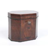A George III mahogany tea caddy with canted corners and ivory escutcheon. With strung ebonized inlay