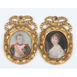 A pair of early nineteenth century portrait miniatures in giltwood and gesso frames depicting