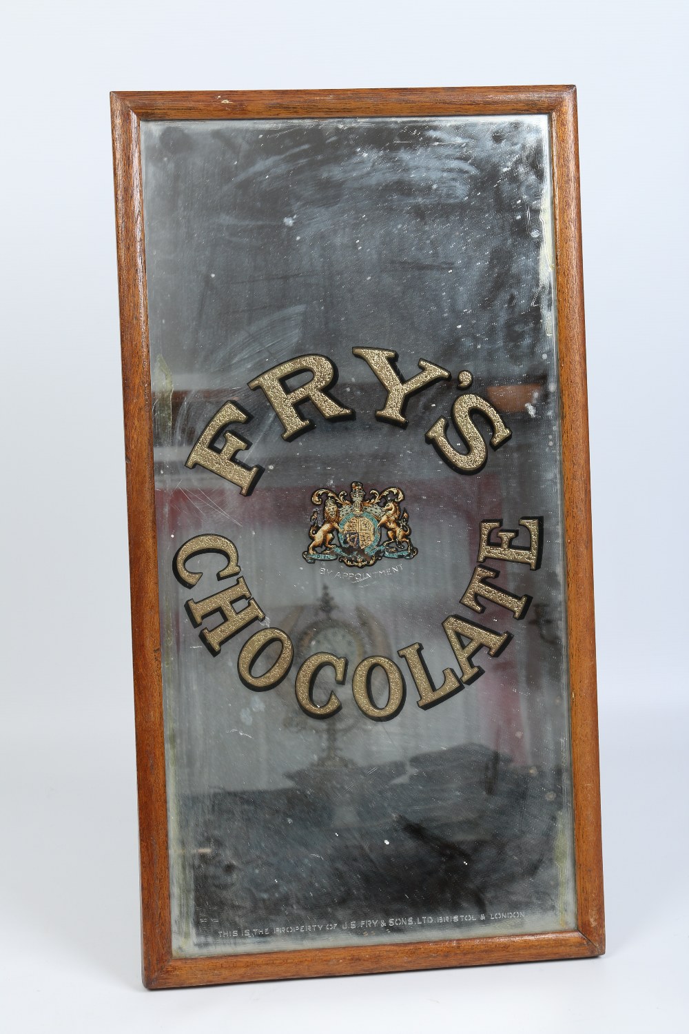 A vintage Royal Warrant Fry's Chocolate advertising mirror with gilt lettering and in oak frame.