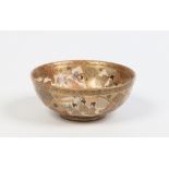 A Japanese Satsuma small bowl. Gilded and enamelled with figures in shaped reserves. Seal mark, 10.