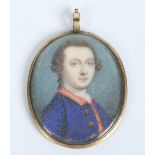 A Georgian pendant set with a portrait miniature of a gentleman wearing a blue overcoat with red