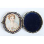 A nineteenth century cased ivory portrait miniature. With yellow metal bezel and depicting a young