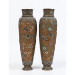 A pair of late nineteenth century Oriental champleve enamel high shouldered vases decorated with