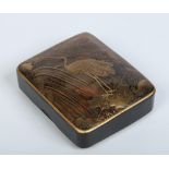 A Japanese Meiji period tortoiseshell box and cover. With lacquer decoration depicting a crane at
