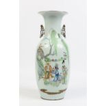 A nineteenth century Chinese baluster floor vase with pierced twin handles. Decorated in coloured