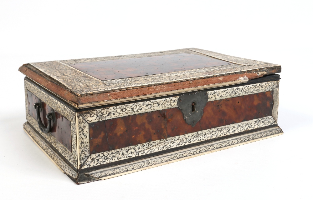 A nineteenth century Anglo Indian tortoiseshell and ivory casket. With foliate penwork decoration