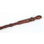 An African carved hardwood staff with wirework grip and carved to the top with a female figure in