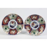 A pair of twentieth century Japanese Imari chargers. Painted with panels of birds and dragons,