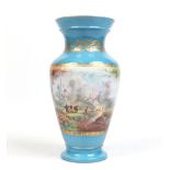 A nineteenth century French Sevres style baluster vase. Blue ground, gilded and painted with an
