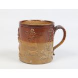 A nineteenth century saltglazed stoneware porter mug. Two tone ground and with sprigged mouldings,