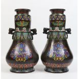 A large pair of Chinese cloisonne baluster shaped vases. With twin mask and loop handles and