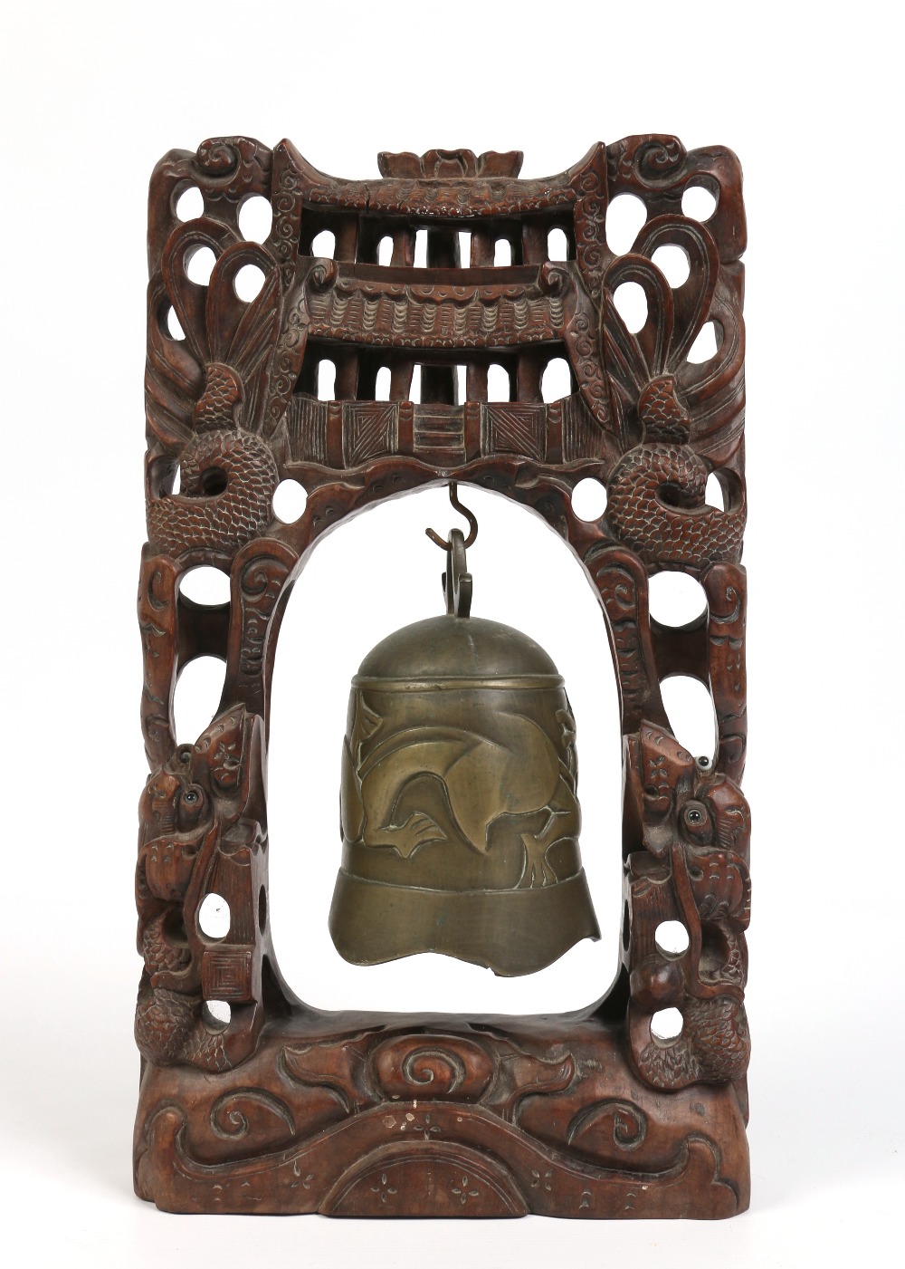 A Chinese bronze gong on carved hardwood frame decorated with dragons having glass inset eyes,