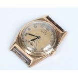 A vintage 9 carat gold cased Omega watch head. With champagne dial having Arabic numeral markers,