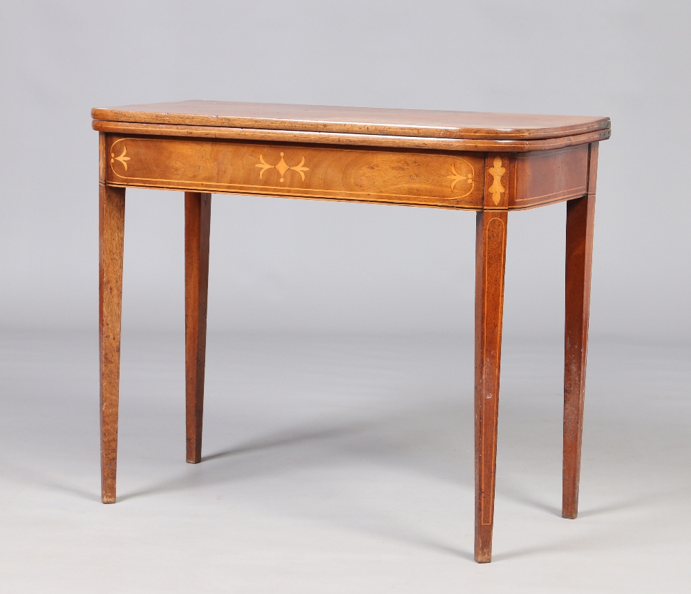 A Victorian inlaid mahogany fold over tea table raised on square supports, 91cm wide. Condition