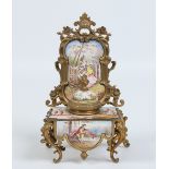 An early twentieth century French gilt metal and enamel encrier. Formed as a rococo dressing table