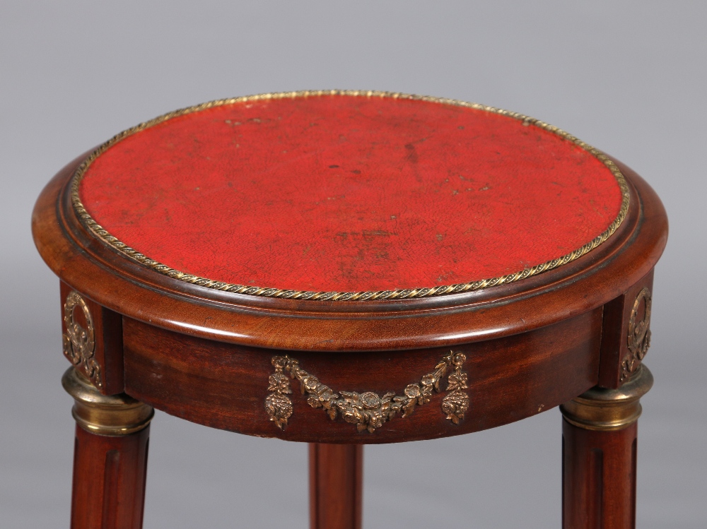 A Victorian mahogany leather topped torchere stand with gilt metal mounts and raised on splay reeded - Image 2 of 2