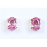 A pair of 9 carat gold and pink sapphire stud earrings, 1.08 grams. Condition Report. To be used