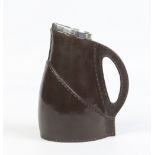 A Doulton Burslem stoneware jug modelled in the form of a leather jack and with silver mounted
