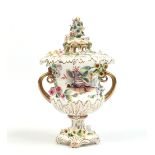 A Rockingham pot pourri vase and cover of campana shape. Encrusted with moulded flowers, enamelled