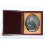 A Victorian daguerreotype in gilt mount and fitted leather case. Portrait of a young gentleman, 7.