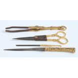 A set of early nineteenth century Indian steel grooming tools with gold overlaid decorations,