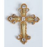 An antique Continental yellow metal cannetille crucifix pendant of stylized form and set with