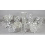 A collection of cut glass items to include vases and decorative items.