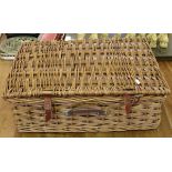 A vintage wicker picnic hamper and contents.