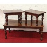 A rectangular mahogany coffee table and matching pair of occasional tables all raised on turned