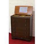 A gentleman's oak dressing chest of five drawers with internal mirror.