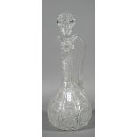 A cut glass wine ewer and stopper.