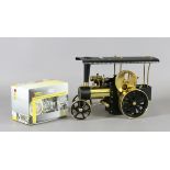 A West German model Wilesco Traktor steam engine with accessories and pewter items.