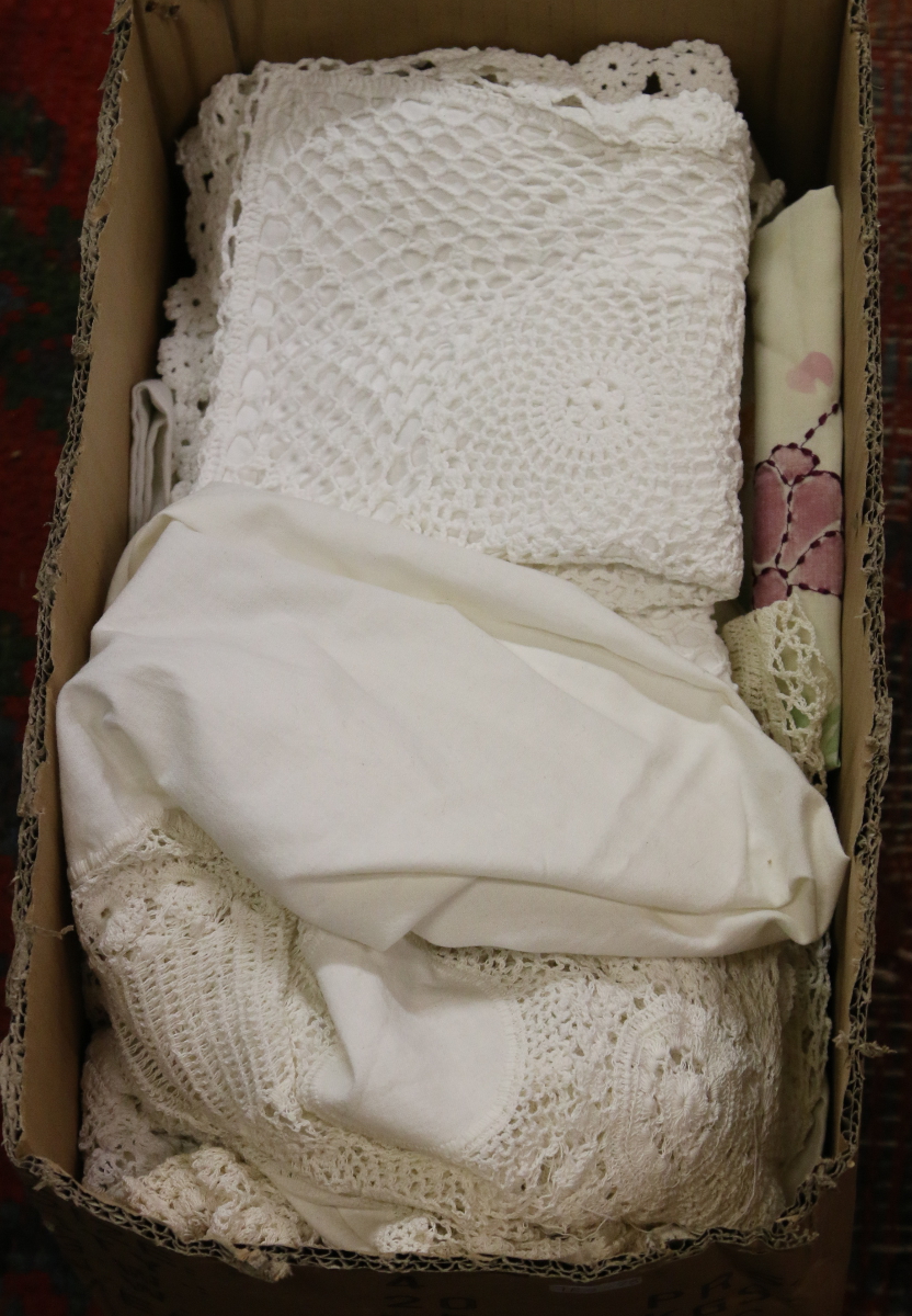 A box of mixed lace and linen.