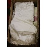 A box of mixed lace and linen.