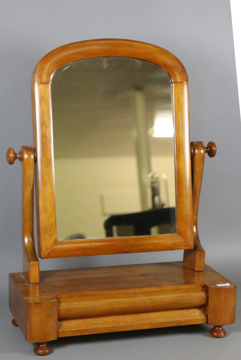 A Victorian mahogany toilet mirror.