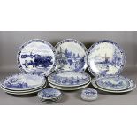 A collection of Delft plates of varying sizes.