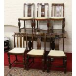 A carved oak bulbous leg draw leaf dining table along with a set of four matching chairs and two