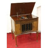 A Columbia Grafonola (gramophone) in walnut case and raised on cabriole legs.