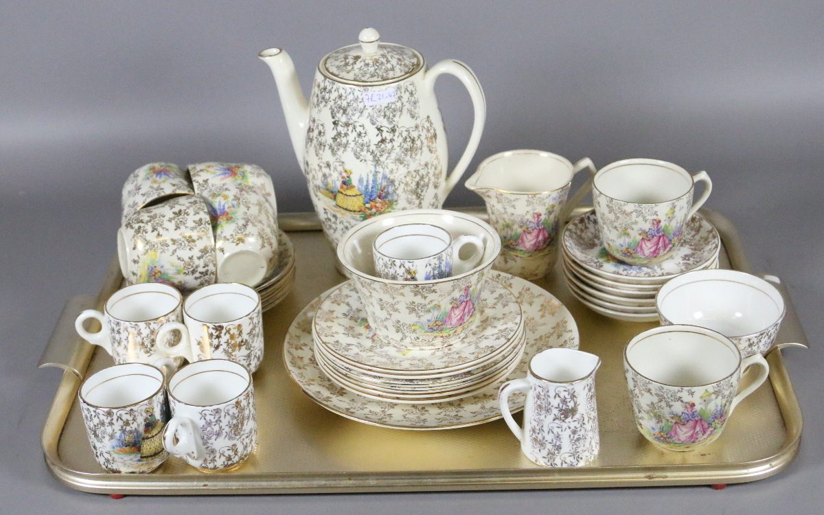 A collection of tea and coffee wares all decorated in a crinoline lady design.