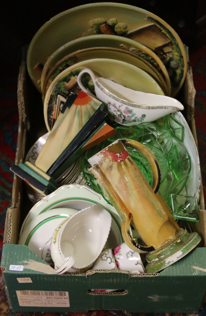 A box of miscellaneous pottery china and glass to include plaster cast wall chargers,