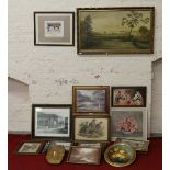 A collection of framed prints and pictures including landscapes and still lifes .