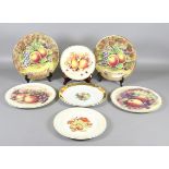 A pair of Baroness hand painted cabinet plates decorated with fruit,