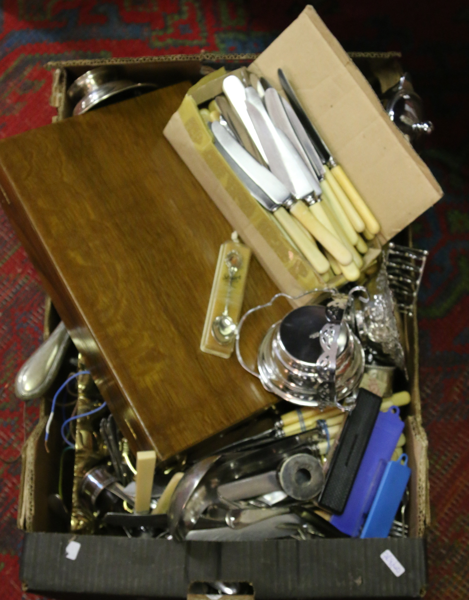 A box of silver plate and metalwares including brass wall lamps,