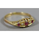 A George VI 18 carat gold ring set with rubies and diamonds assayed Sheffield 1943, size R.5.
