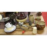 A collection of kitchen wares cast iron scales and weights, stoneware rolling pins,