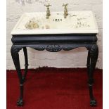 A Victorian Delta ornate cast iron based wash stand raised on ball and claw supports and set with