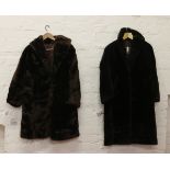 Two ladies full length fur coats.