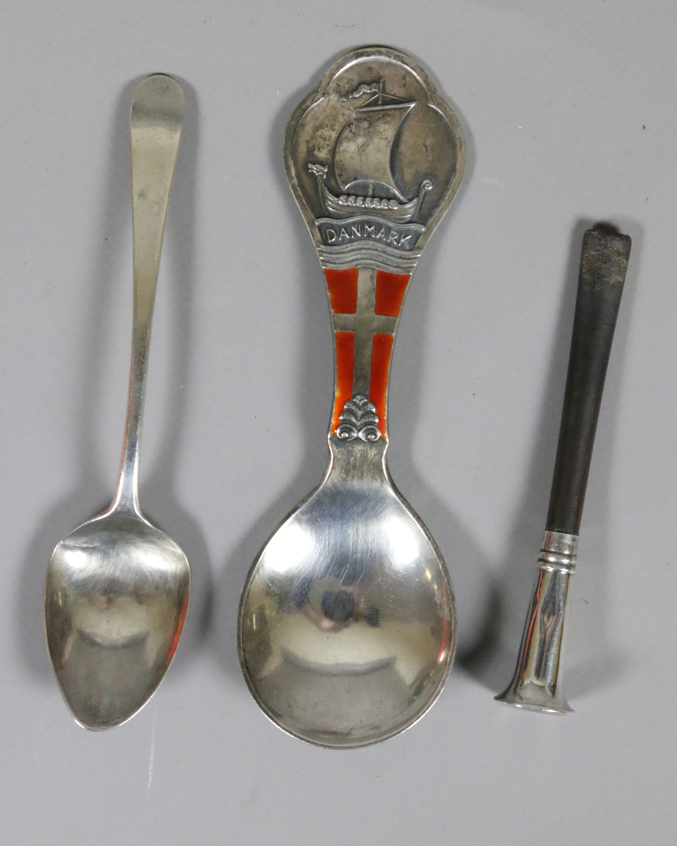 A Danish silver caddy spoon chased to the trefoil terminal with a long boat and enamelled with the